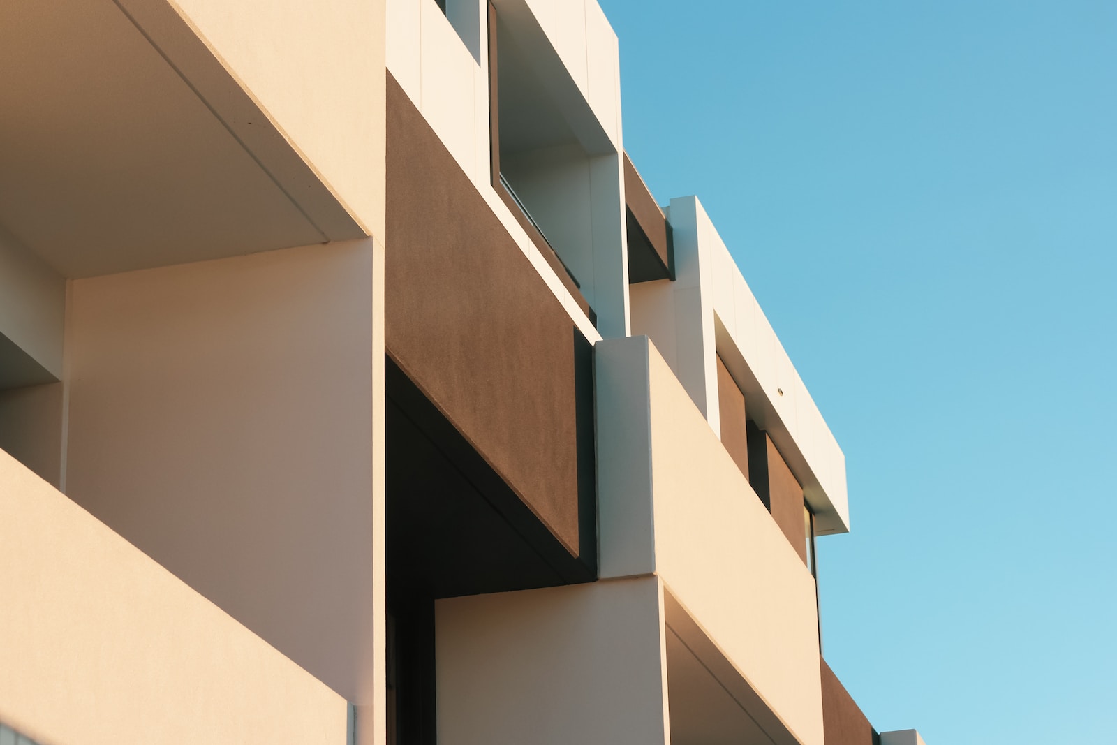 beige concrete building under blue sky during daytime